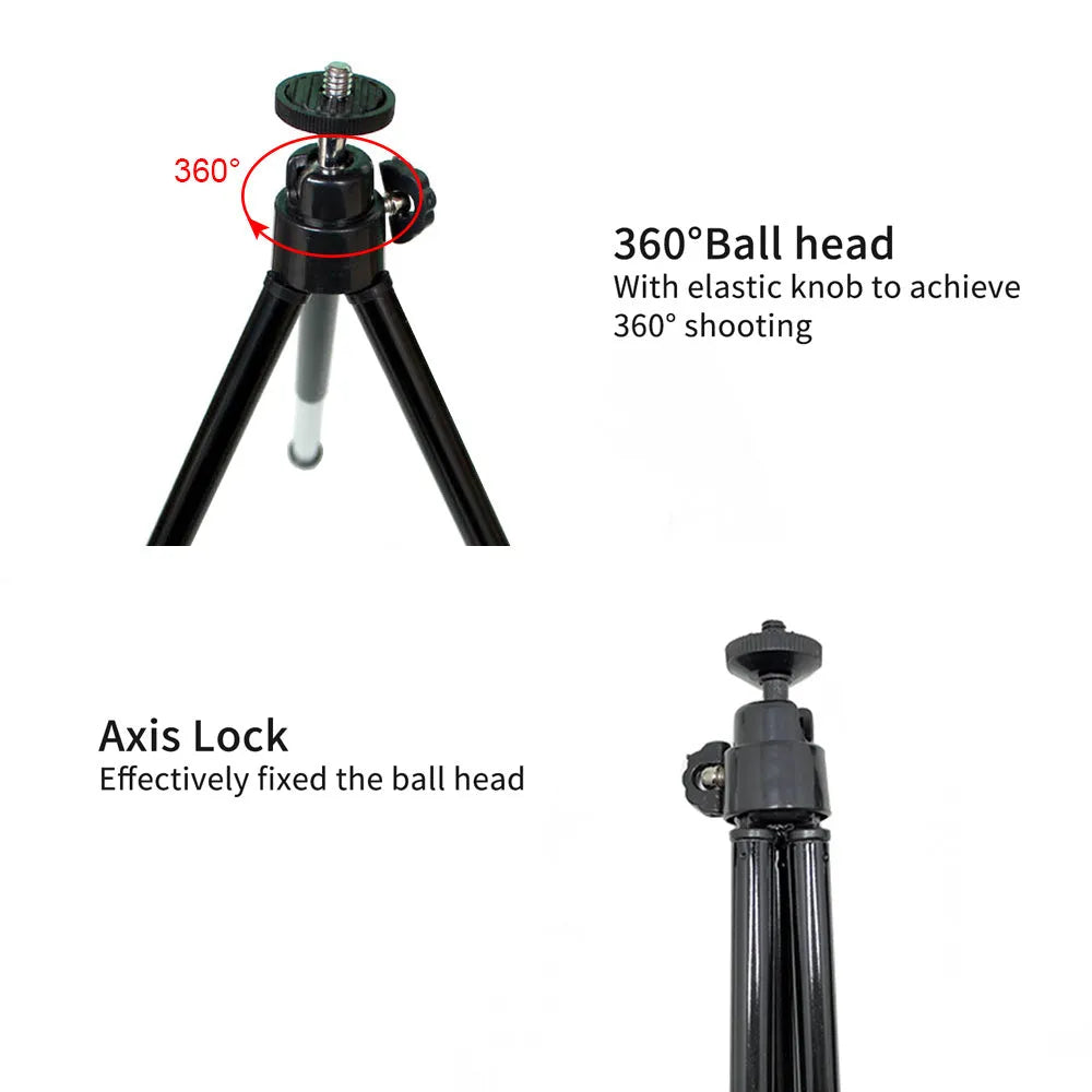 Black mini desktop camera tripod with extended legs and a U-shaped phone clip attached, on a white background.