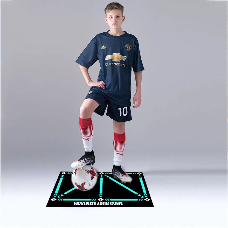 Black non-slip football training mat measuring 60 by 90 centimetres laid flat.