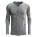 Men's solid colour cotton blend henley shirt with long sleeves and buttoned placket.