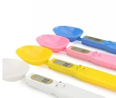 White digital spoon scale with LCD display showing weight measurement for kitchen ingredients