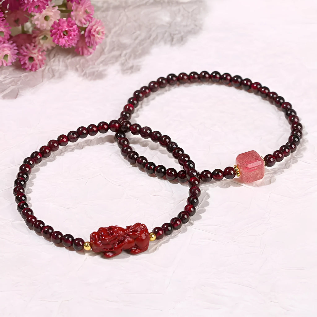 A square geometric bracelet for women made from natural Garnet and Strawberry Quartz with a carved Pixiu charm.
