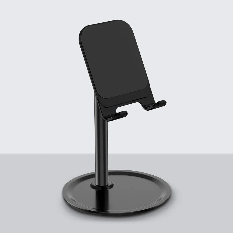 Silver white aluminium alloy mobile phone stand holding a smartphone on a desk
