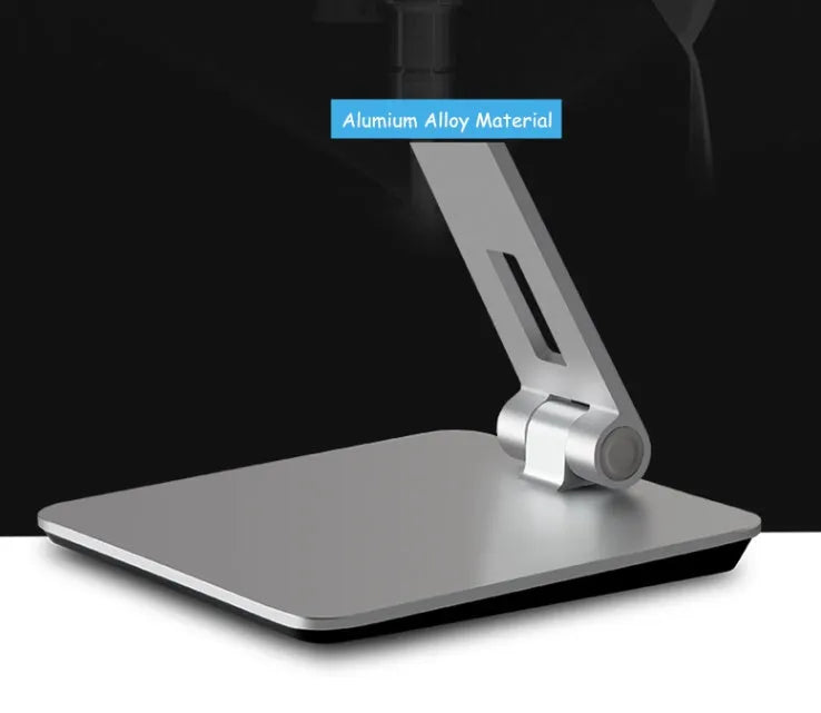 Folding aluminium desktop stand holding a tablet, showing its 360-degree rotation hinge and black/silver colour options.