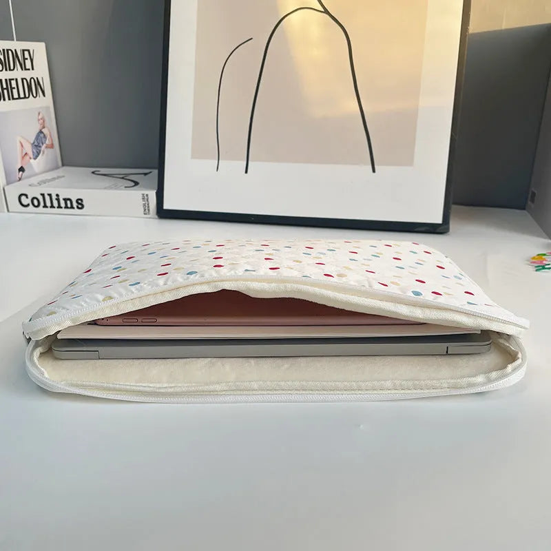 Women's polka dot laptop bag in solid colour with size options for 11, 13, and 15.6 inch computers.