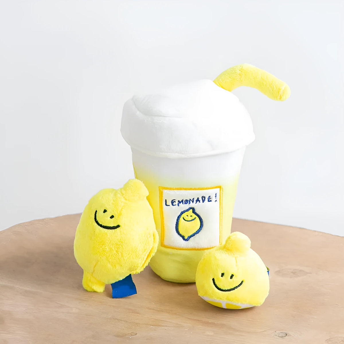 Yellow plush lemon tea cup pet toy with BB call and side snack pocket