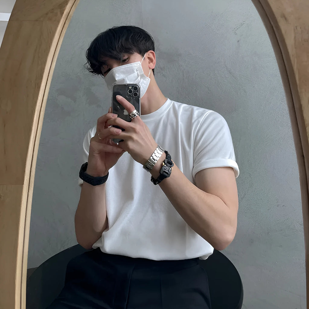 Men's black slim fit cotton T-shirt with round neck and half sleeves on white background