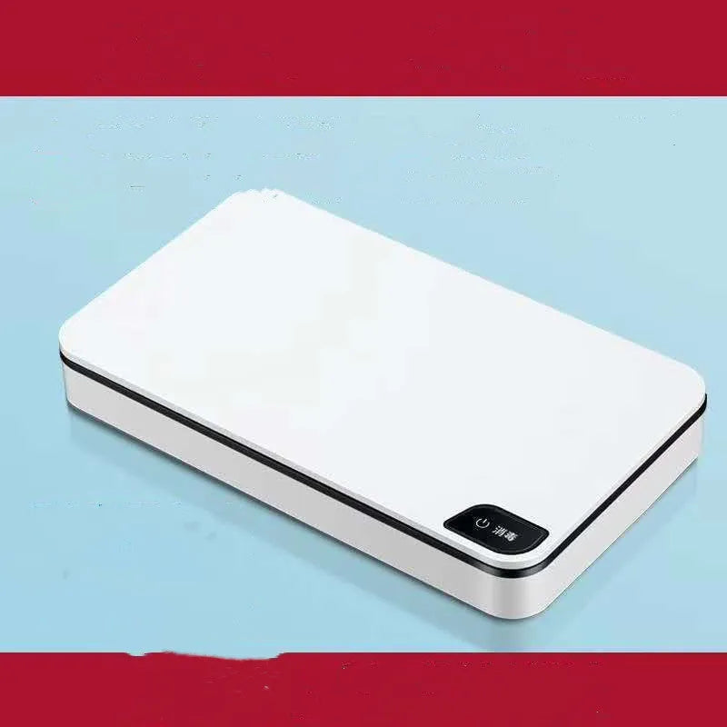 White ultraviolet mobile phone steriliser with wireless charging pad and remote control for home use