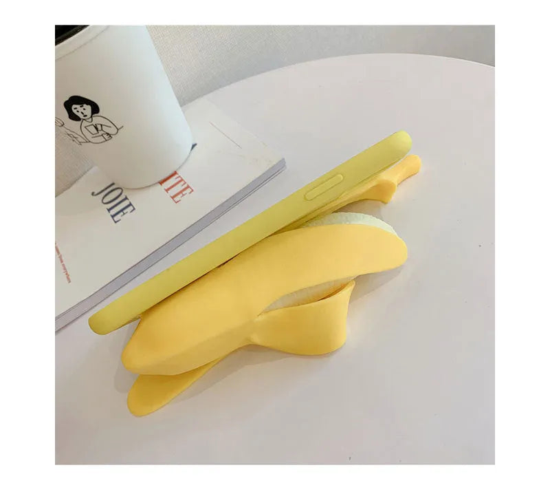 Banana yellow silicone iPhone case with unzip design detail showing anti-slip texture