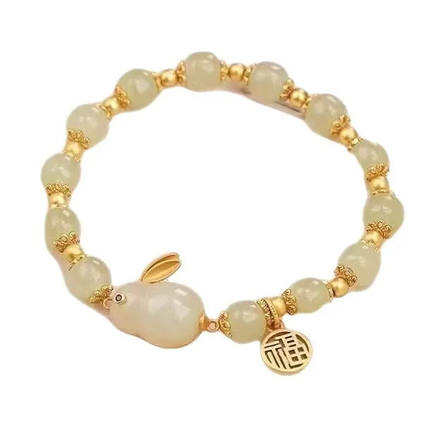 Green jade hare bracelet for women with Chinese style zodiac animal design and lily decorations
