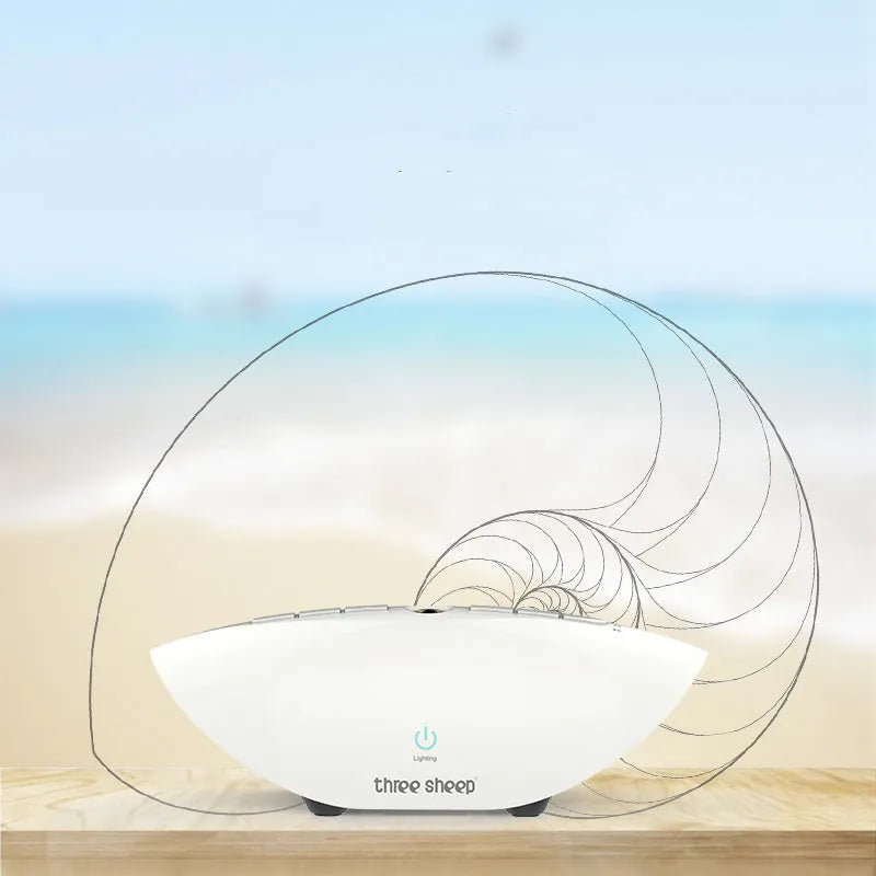 White rechargeable sleep sound machine with mechanical buttons on a white background