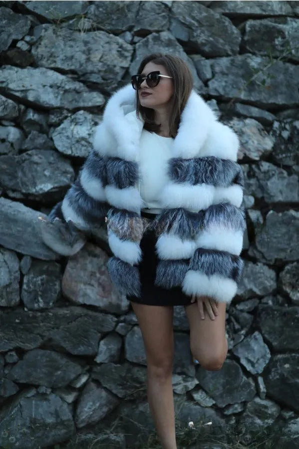Women's brown artificial fur hooded coat on a hanger, street fashion style.