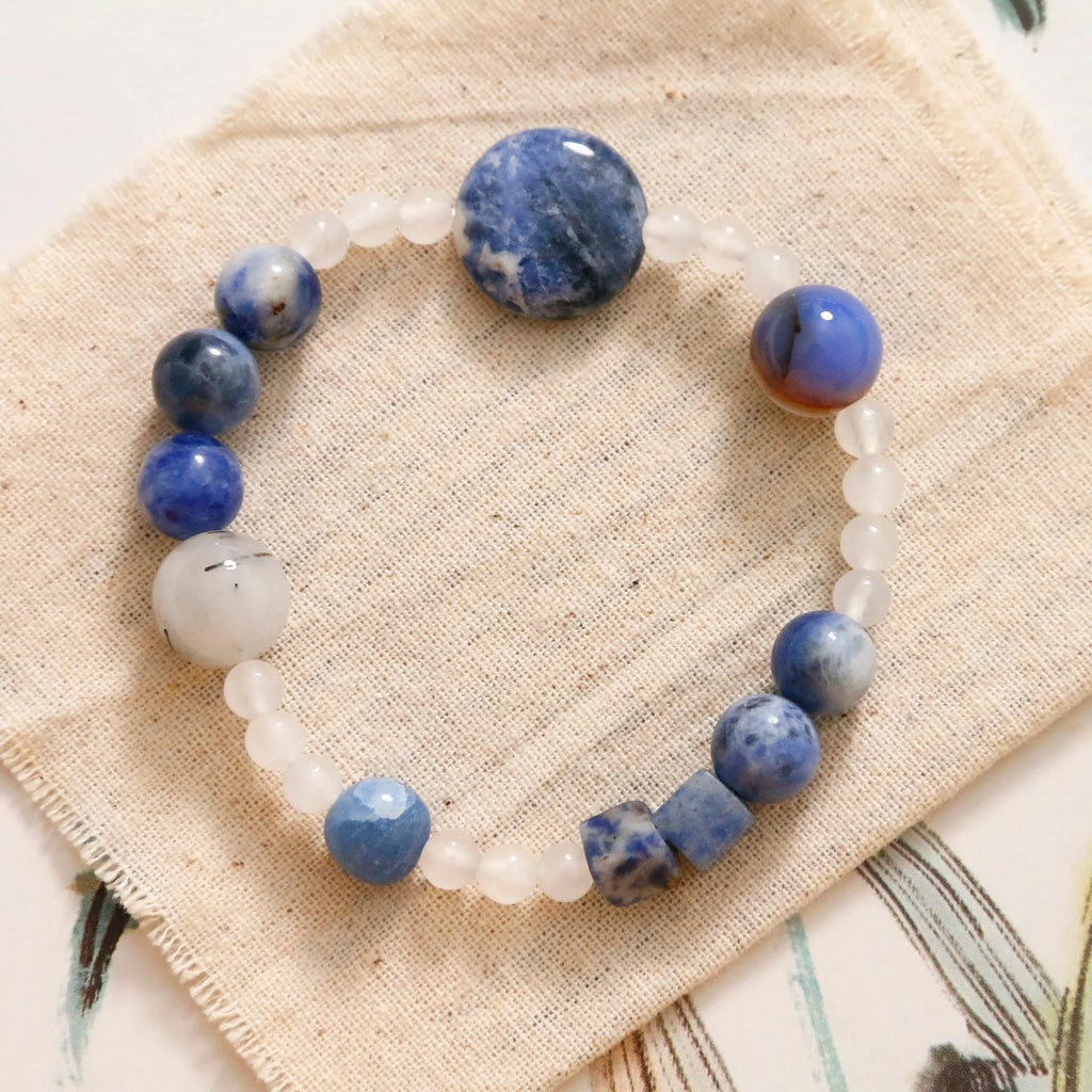 Hand-woven natural blue point and black hair crystal agate bracelet with geometric stone elements