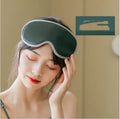 Portable eye SPA massage goggles showing super fibre material and suede shell, with USB cable connection for heating and vibration functions