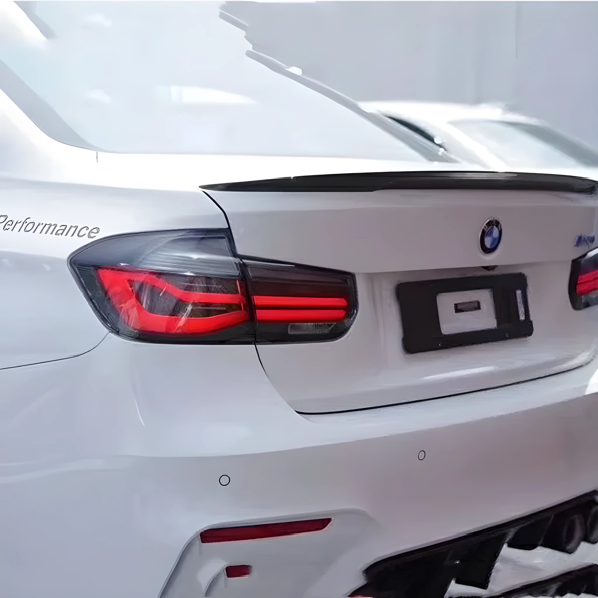 Modified BMW 3 Series tail light assembly with streamer LED pattern in red or smoked black finish