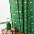 Red Christmas curtain with printed cartoon snowman and angel figures