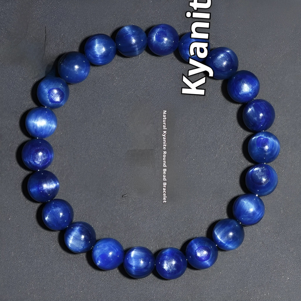Natural blue crystal ball bracelet with geometric Ruyi design on a wrist.