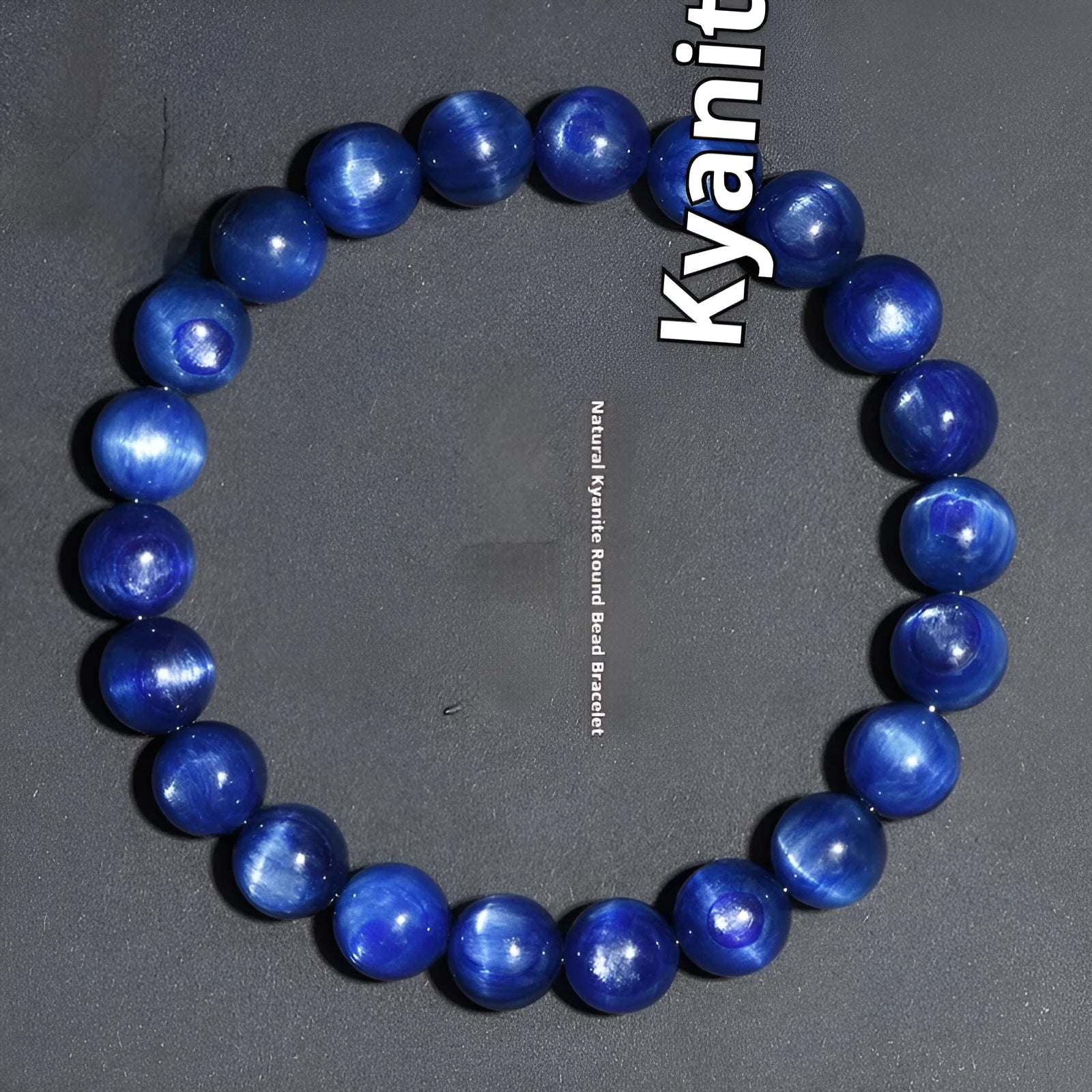 Natural blue crystal ball bracelet with geometric Ruyi design on a wrist.