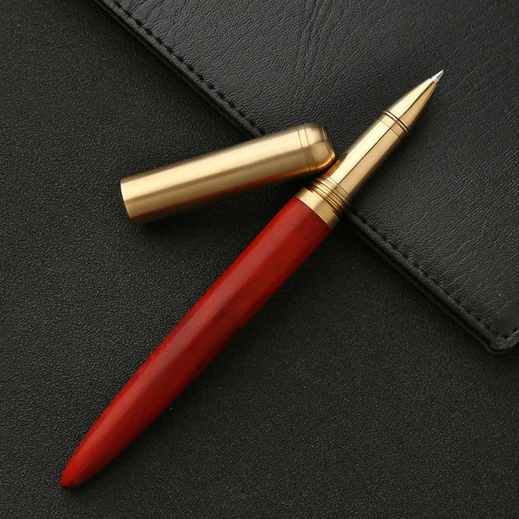 Brass sandalwood signature pen with wood grain visible on 14cm long writing instrument