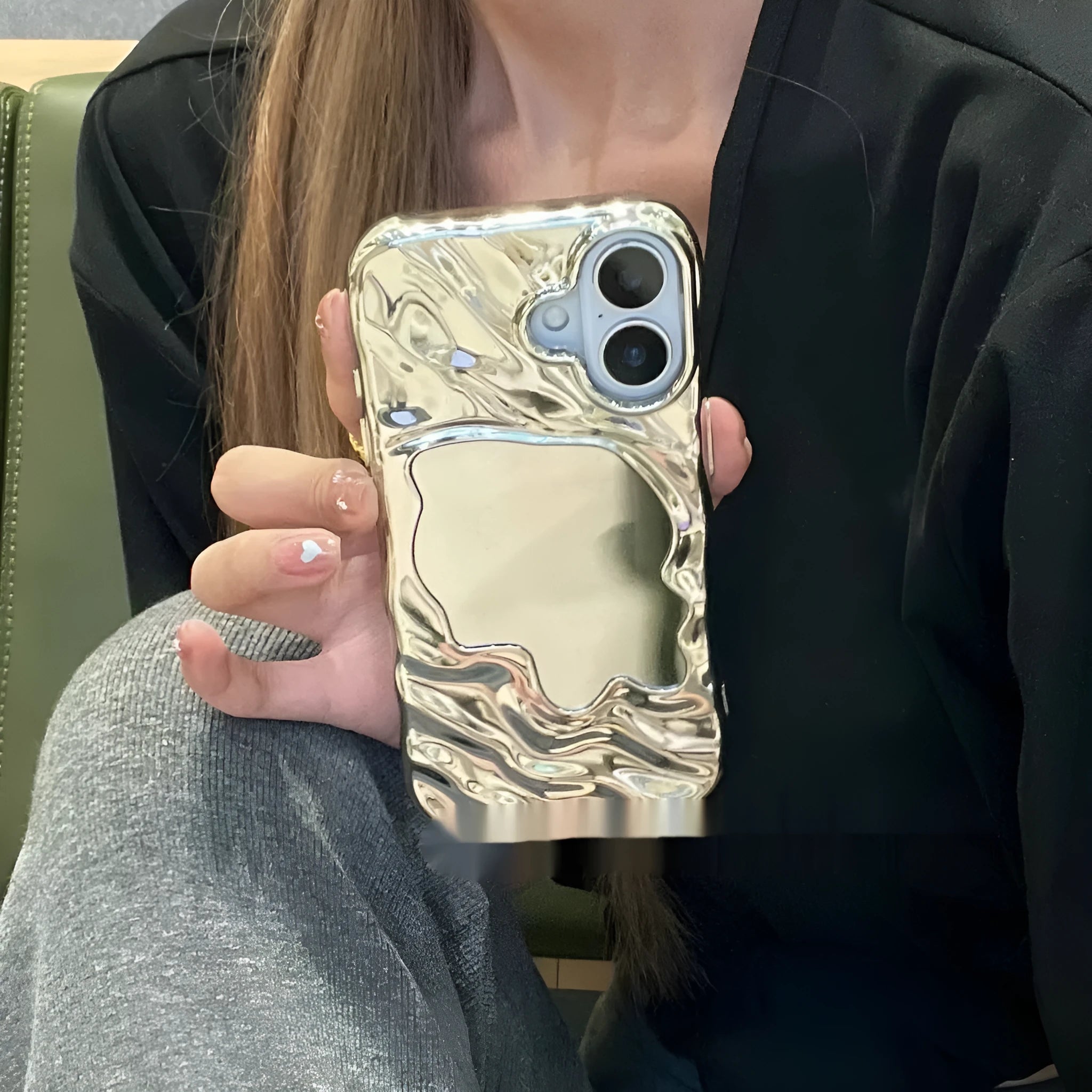 Water ripple solid colour mirror iPhone case in beige, shown on an iPhone