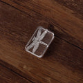 Transparent acrylic hand seal with clear silicone stamp on a white card, showing dragonfly or fern engraving.