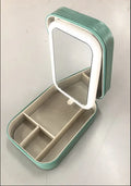 Portable makeup storage box with LED mirror in cherry blossom pink showing adjustable stand and storage compartment
