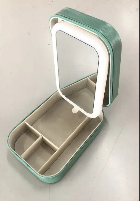 Portable makeup storage box with LED mirror in cherry blossom pink showing adjustable stand and storage compartment