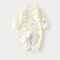 Infant in long climb style cotton pajamas with cartoon dragon print, Class A fabric.