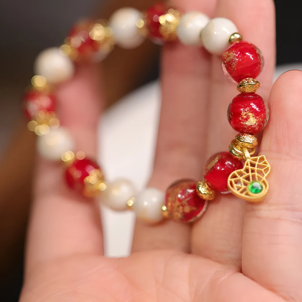 Gold foil coloured glaze ethnic bracelet for women with geometric design and Xingshi elements