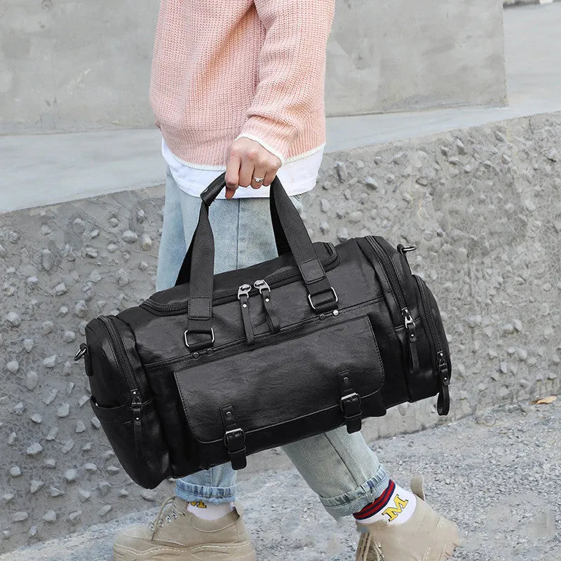 Large black PU travel bag with a separate shoe compartment, shown with dimensions 52cm by 19cm by 27cm.