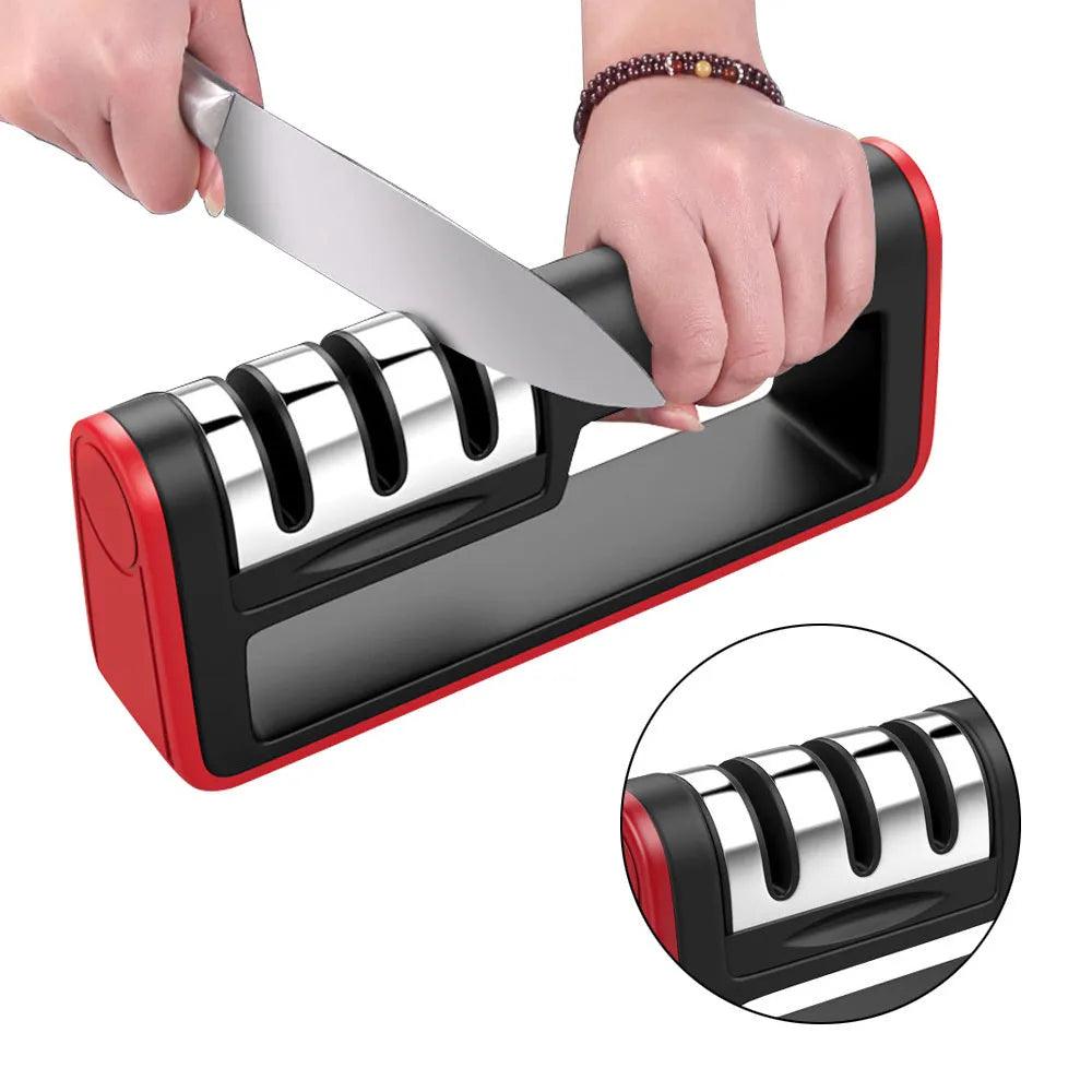 Professional three-stage knife sharpener in black with red trim, showing coarse, ceramic and fine abrasive slots.