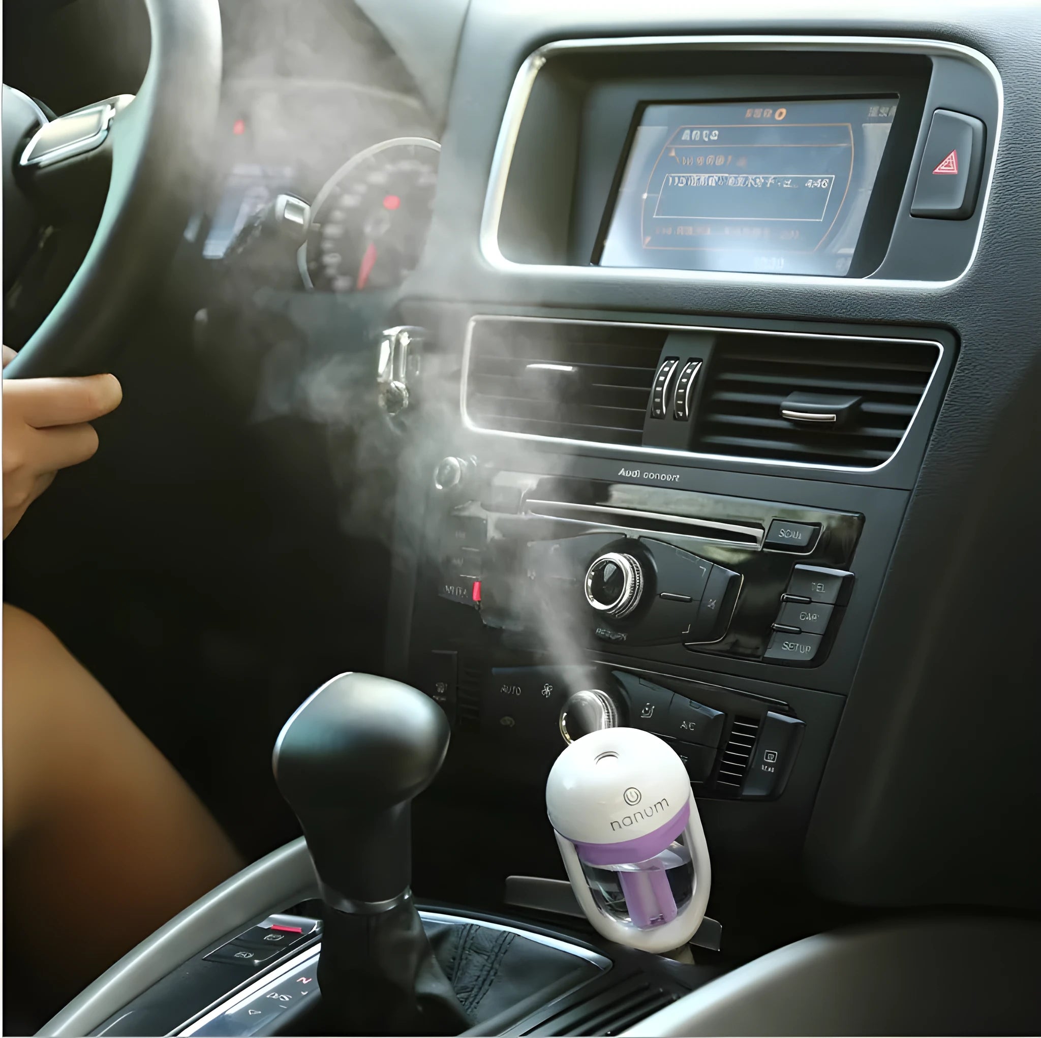 Portable car humidifier with essential oil diffuser function showing compact design for vehicle use
