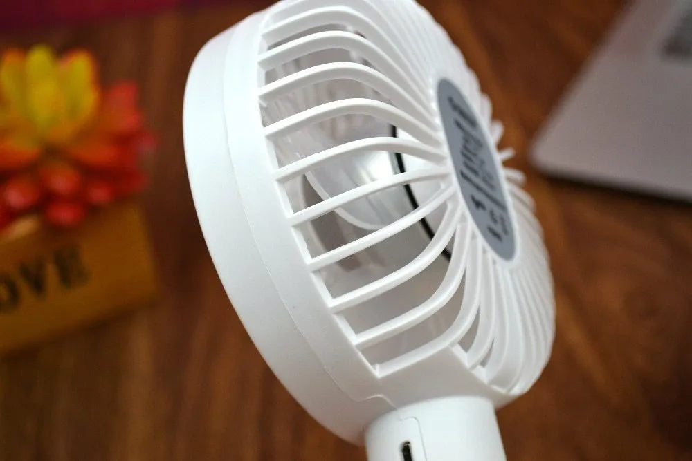 White ORICO FH1 portable USB rechargeable desk fan on a table