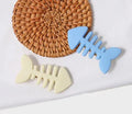A minimalist fishbone design duckbill clip hair barrette in a muted candy colour.
