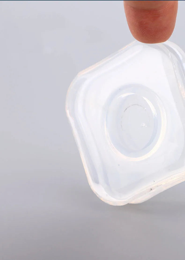 Transparent silicone nano gel adhesive pads in circle and square shapes on a dashboard.