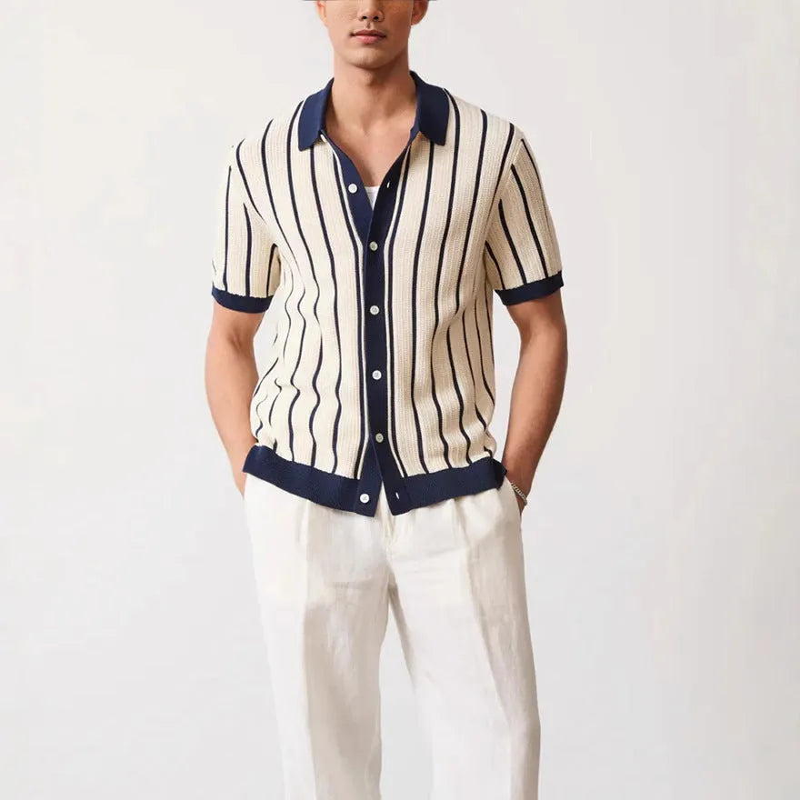 Men's white short sleeve knitted top with lapel collar and asymmetric design.