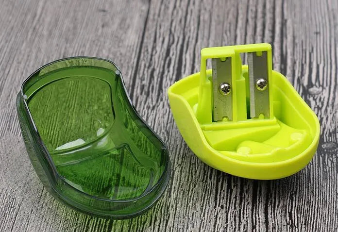 Double hole manual pencil sharpener for standard and thick pencils in a random colour