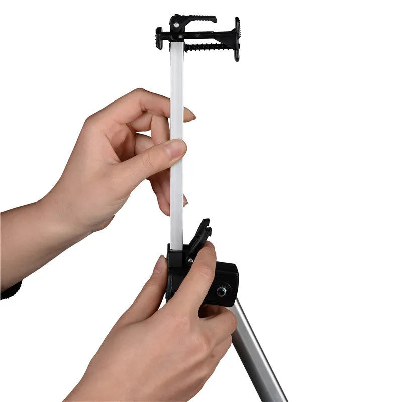 Silver aluminium alloy adjustable easel with metal tray, collapsed for table top use, next to a black nylon carrying bag