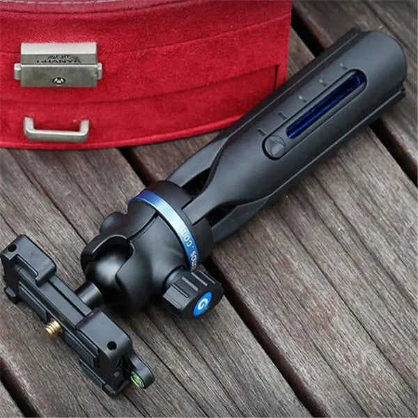 Black desktop tripod holding a mobile phone, showing adjustable bracket and plastic-aluminium construction