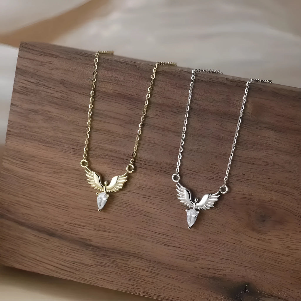 Close-up of an adjustable silver eagle pendant necklace on a textured background, showing the O-ring chain.