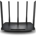 Black dual-band Gigabit wireless router with antenna and LED indicators on white surface