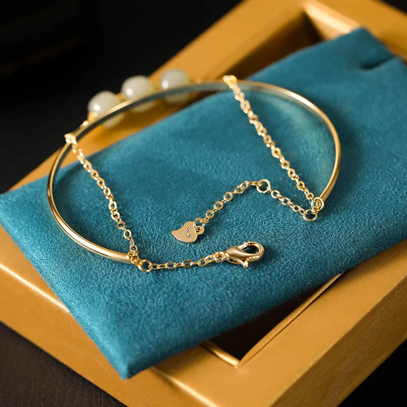 Women's jade lucky beads bracelet with gold inlay, shown in single, double, and three bead versions.