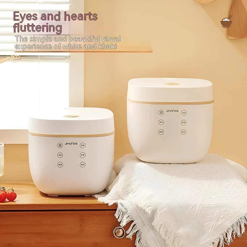 White or beige 3L rice cooker with black inner pot, rice scoop, measuring cup and steamer basket