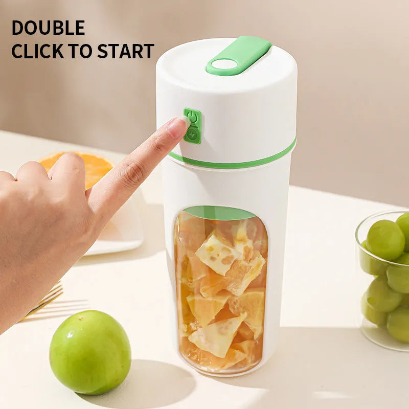 Portable electric juicer with USB charging cable next to 400ml plastic blending cup