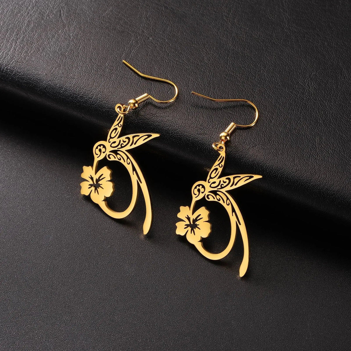 Pair of stainless steel hummingbird earrings with hollow openwork design, available in gold or steel colour