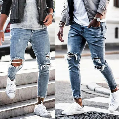 Men's light blue straight fit distressed jeans with embroidered details and zip fly
