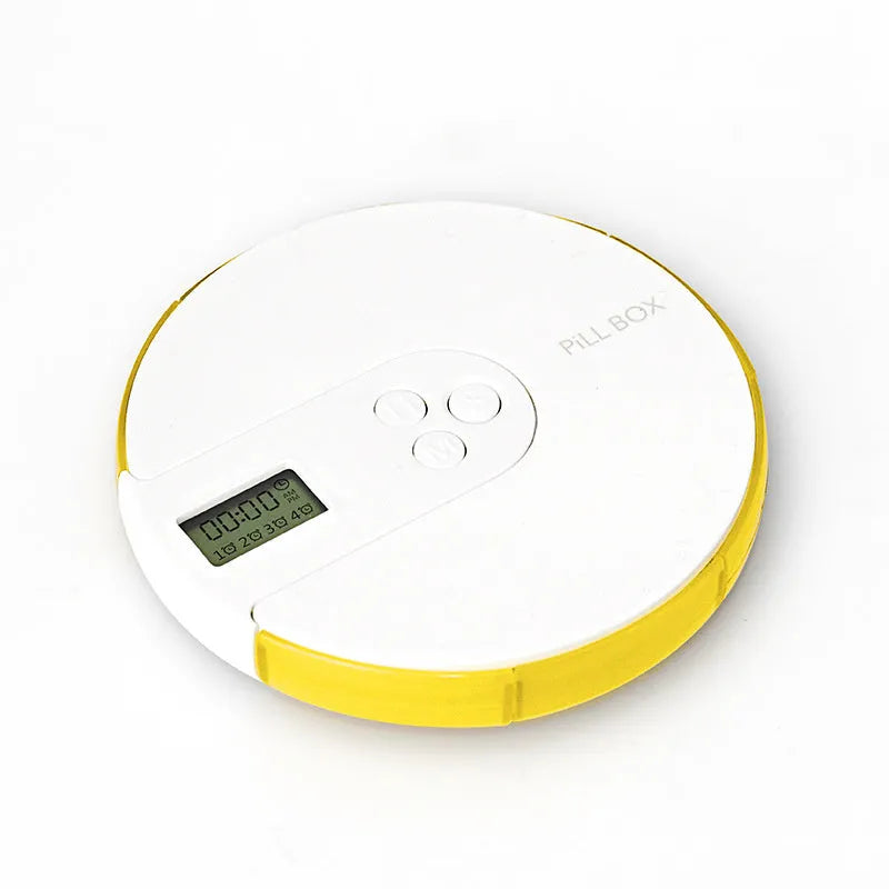 Blue 7-compartment alarm clock pill dispenser showing time display and open compartments.