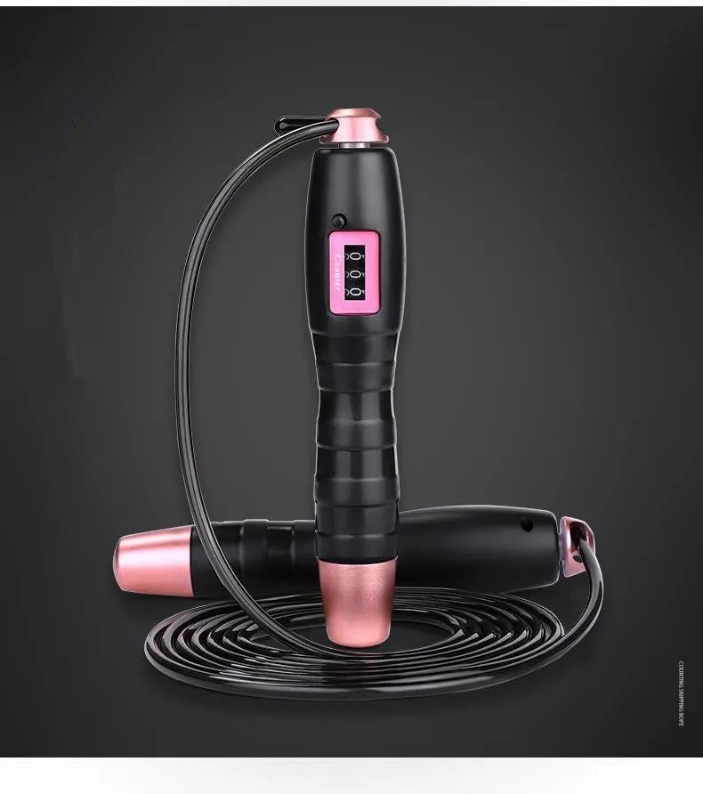 Adjustable digital skipping rope with ABS handles and TPU coated steel cable in black and pink for fitness exercise.