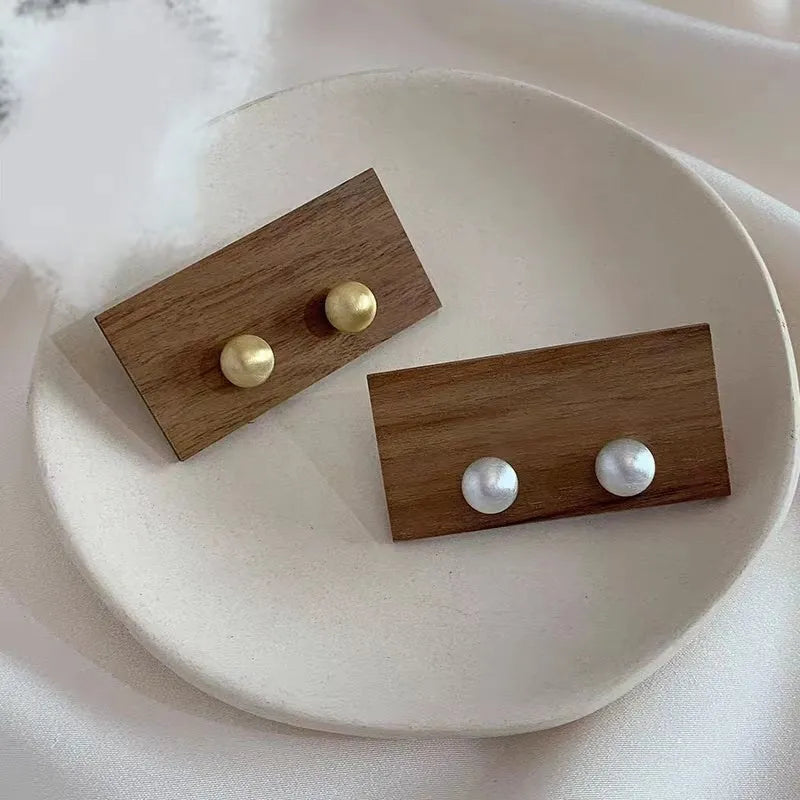 Matte brushed bean earrings for women in Gold and White colour options with a low-profile versatile design