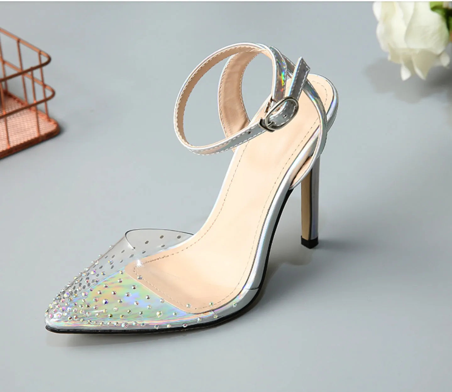 Women's pointed toe sandals with diamond pattern and stiletto heel on a white background.