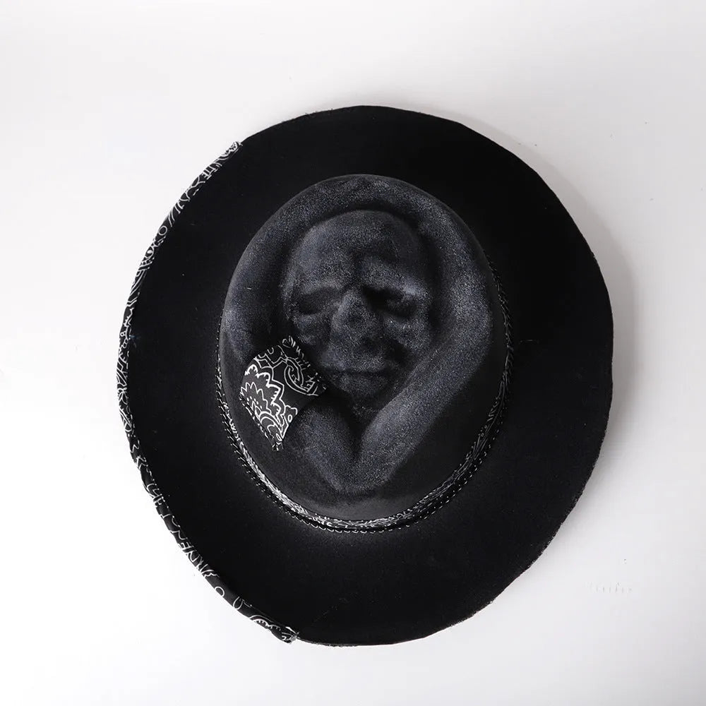 Handmade wool felt skull hat with a conical crown on a model, monochrome print.
